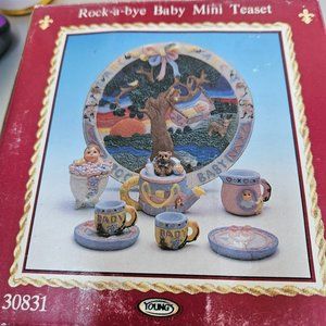 vintage roc-a-bye baby mini tea set. Marked 1996 on bottom.in origin box.